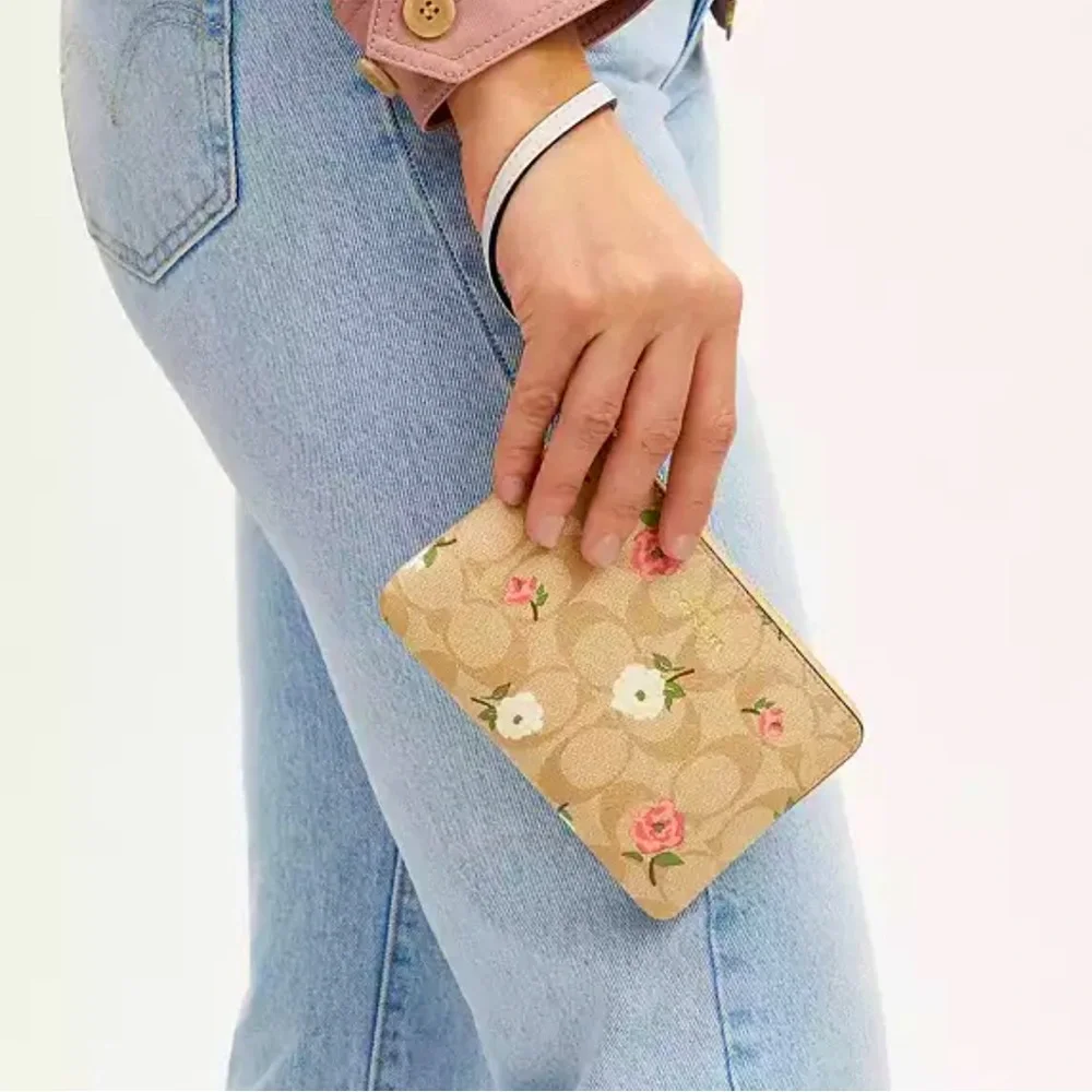 New with tag Coach Corner Zip Wristlet In Signature Canvas With Floral