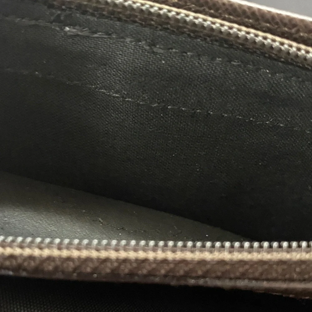 Salvatore Ferragamo Deep brown leather wallet with gold accent