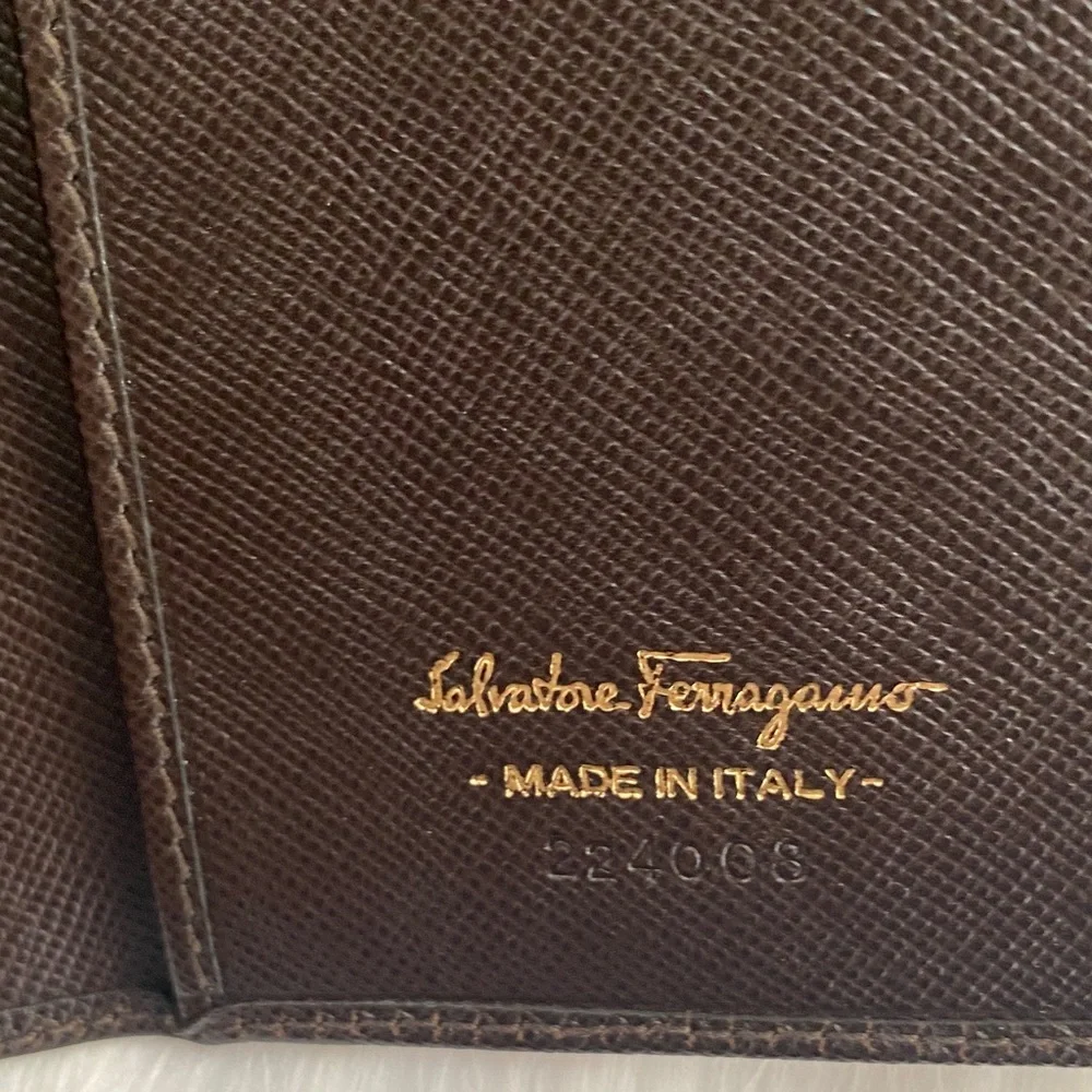 Salvatore Ferragamo Deep brown leather wallet with gold accent