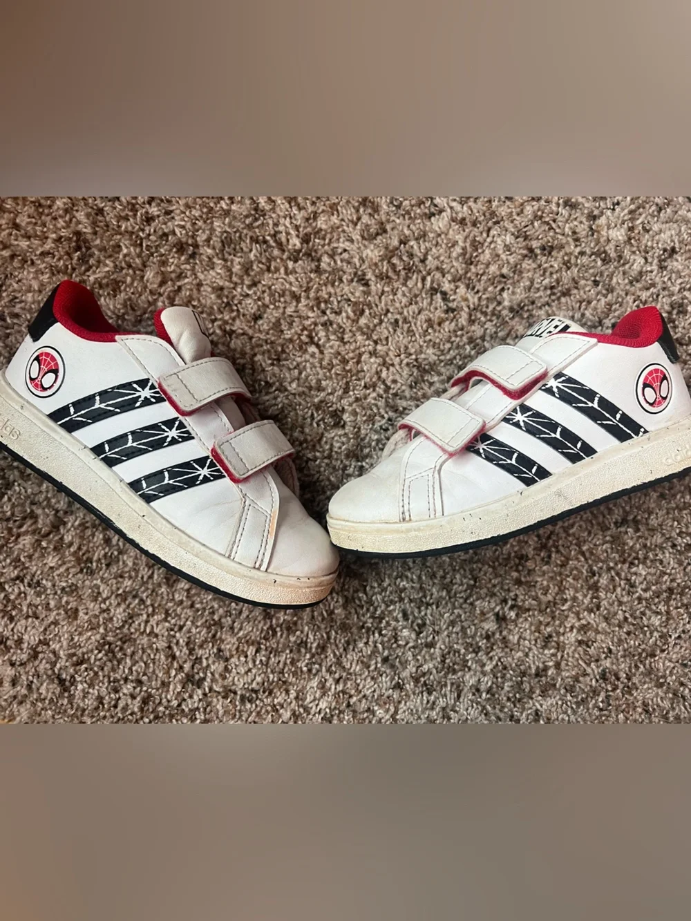 White Kids Sneakers with Black Stripe Detail and Red Accents