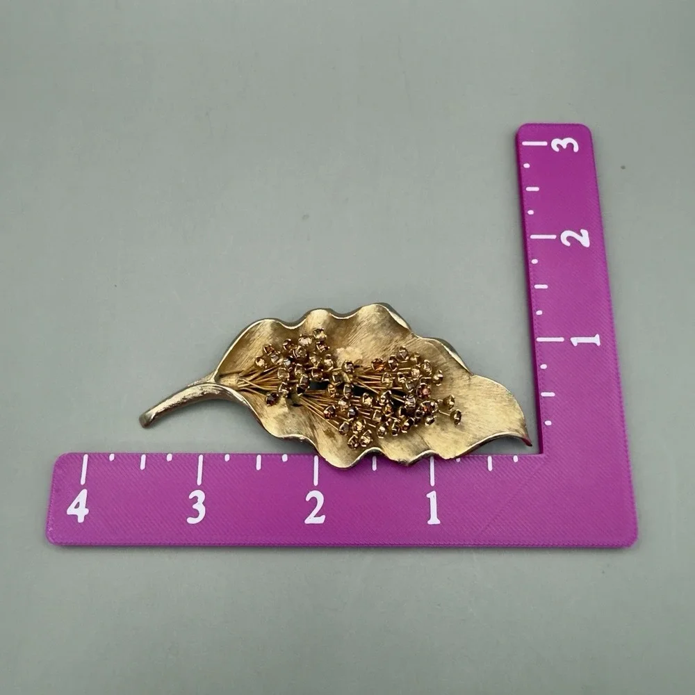 The Unbranded Brand brooch resembling