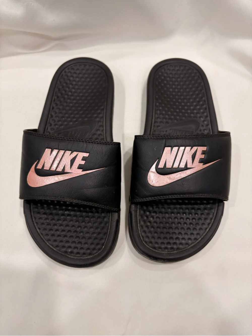 Woman’s Nike Benassi Black and Rose Gold Slides Size 7