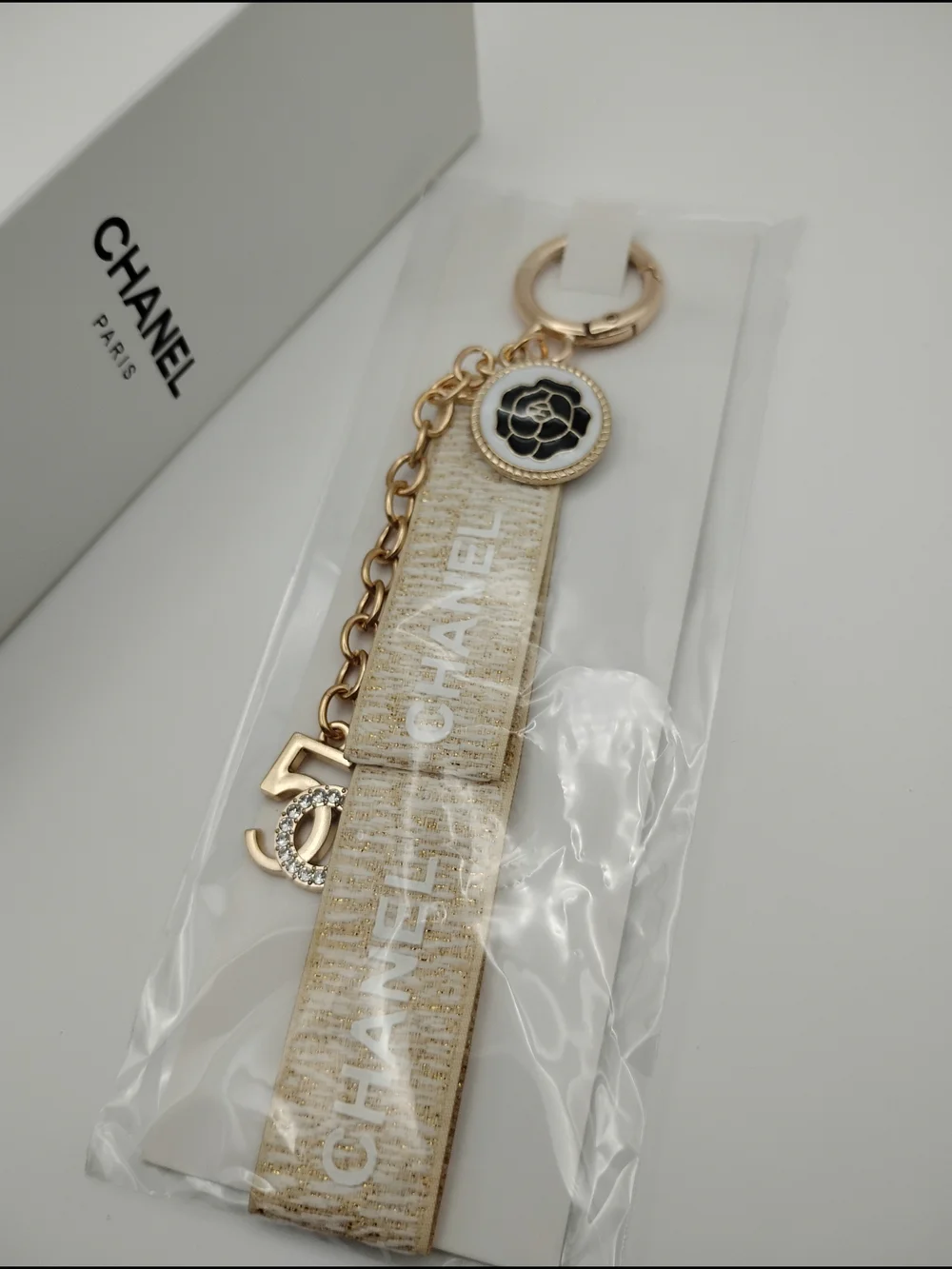 CHANEL Gold and Ivory Logo Charm Strap Keyring AUTHENTIC -BNIB