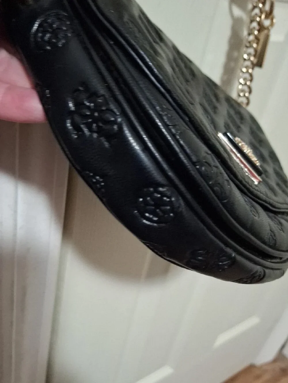 GUESS Black Embossed Leather Shoulder Bag with Gold Chain and Charm Accent