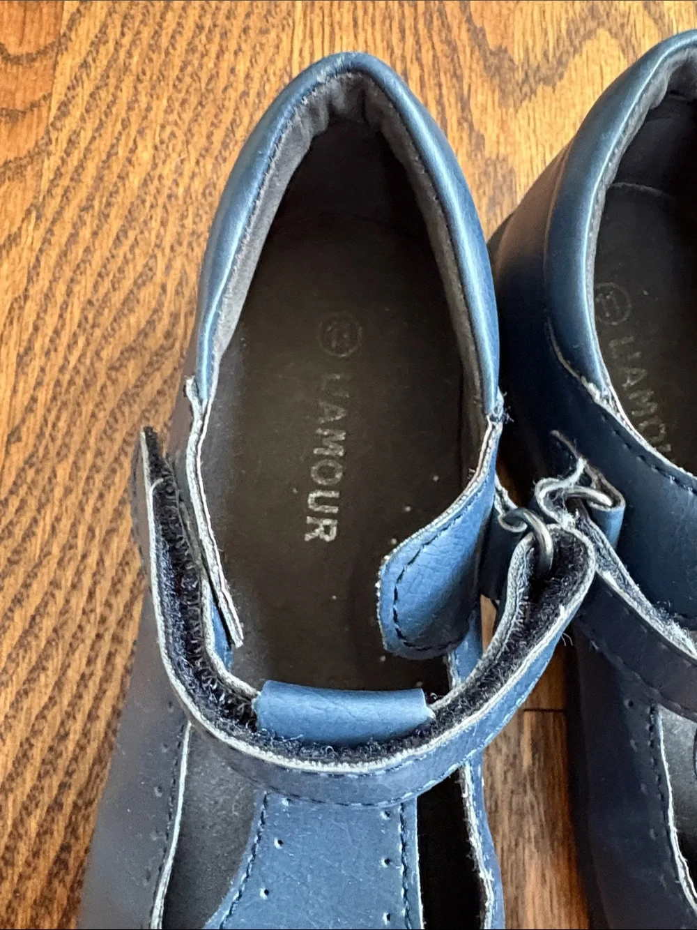 L'Amour girls navy blue with cutout pattern t-strap Mary Jane shoes, size 11.