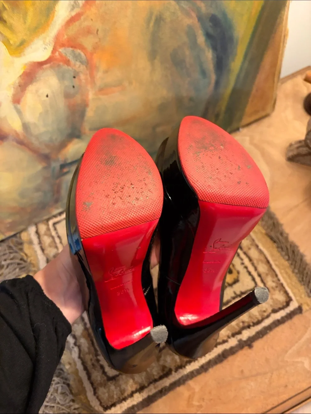 Christian Louboutin each showing description